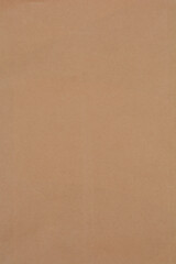 A simple, textured background of beige or light brown paper, perfect for various design and creative projects