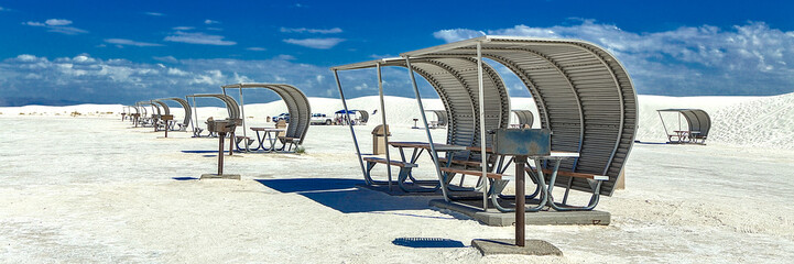 The portable picnic shelters look like sails scattered across the ocean. Blocking the wind and sand, while providing some much need shade from the harsh sunlight. White Sands National Park