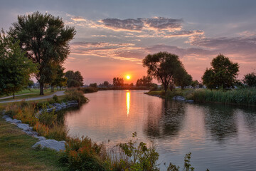 Fototapeta premium captivating summer sunsets and sunrises create enchanting atmosphere over tranquil lake