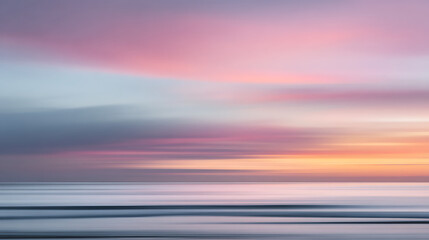 Soft pastel sky over tranquil ocean waves in abstract long exposure image