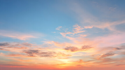 Fototapeta premium Gentle sunrise sky with pastel clouds and soft light pink