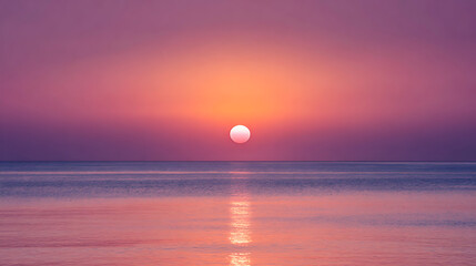 Vibrant sunset over calm ocean waters reflecting pink and orange hues reflection
