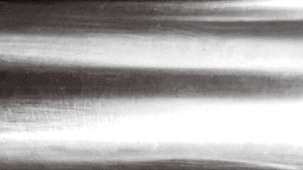 Abstract metallic texture in grayscale with light and shadow gradients