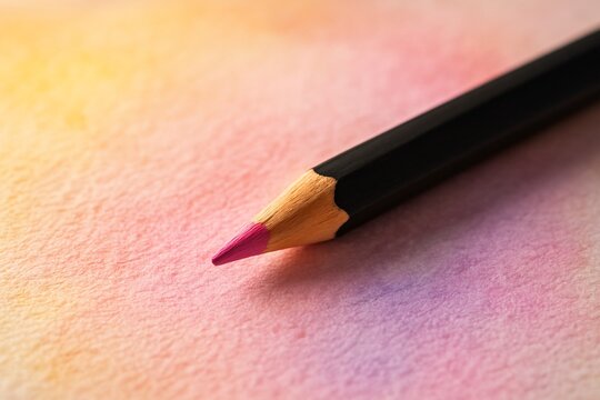 Pink colored pencil on gradient background
