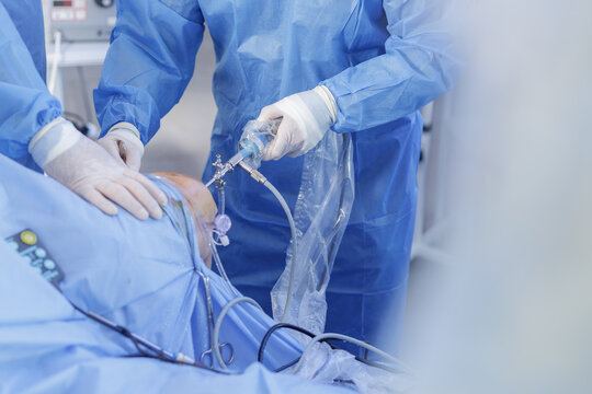 Knee arthroscopy with PCL reconstruction and arthroscope in sterile operating theatre