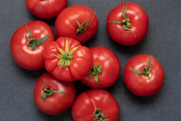 Fresh Ripe Red Tomatoes on Black Background with Copy Space. Minimalist Food Photography