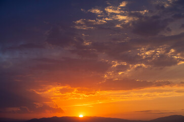 Beautiful sunset over the lake and mountains. 