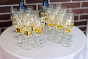 clear champagne glasses at a festive event
