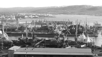 Cranes and port facilities on a sunny autumn day.