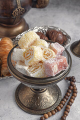 Turkish delight in an antique glass Turkish delight bowl. Tea with oriental sweets. Close-up
