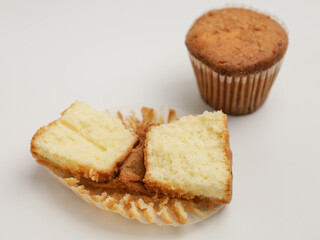 Vanilla cupcake on white background