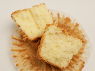 Vanilla cupcake on white background