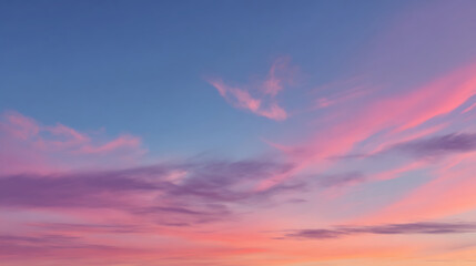 Obraz premium Sky gradient with wispy pink and purple clouds at sunset image