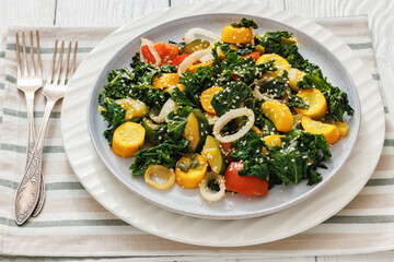zucchini kale tomato saute sprinkled with sesame
