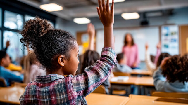 thirst for knowledge: schoolgirl in class wants to answer