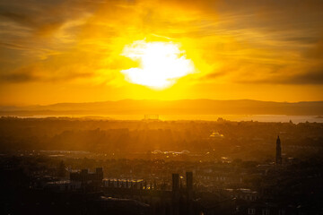 Fototapeta premium sunset over edinburgh over the firth of forth, view from calton hill, edinburgh, scotland
