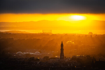 sunset over edinburgh over the firth of forth, view from calton hill, edinburgh, scotland