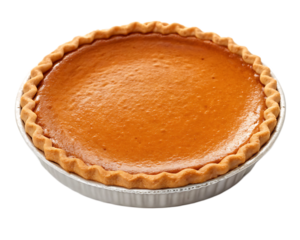 A top view of a whole pumpkin pie with a crimped crust in a white pie dish against a black background