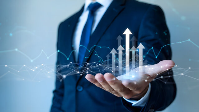 Professional business concept image showing a businessman holding a rising arrow graph and a futuristic network connection.