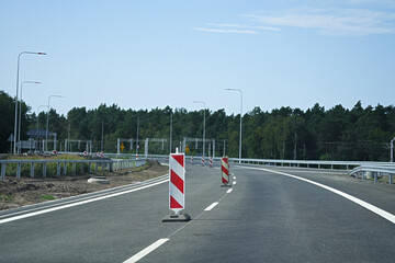 A section of road under construction or repair with established traffic barriers indicating a change in traffic