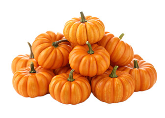 A pile of small orange pumpkins with green stems stacked on top of each other on black background