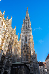 Photo of the beautiful tower of St. Stephen's Cathedral on a sunny day taken from the square