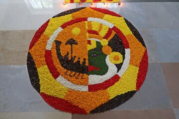 pookalam designs for onam celebrations , pookalam made for part of onam celibration in kerala, india. it also referred to as athapookalam, is often made in a circular shape with flowers on floor