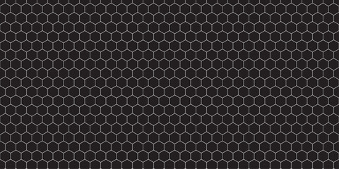 Abstract black and white carbon fiber texture with a metallic hexagonal pattern, a seamless industrial mesh design