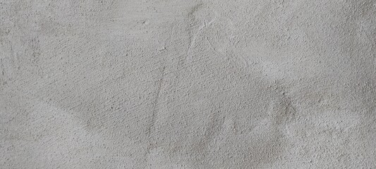 Concrete Wall With Textured Surface Showing Signs of Wear and Potential Artwork in a Modern Urban Environment