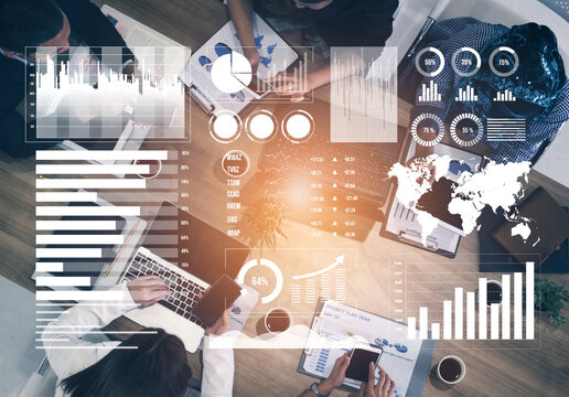 A diverse business team collaborates over data analysis and charts in a modern workspace, aiming to devise effective strategies for future projects. Impute