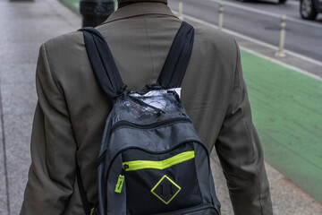 business man with old fraying backpack