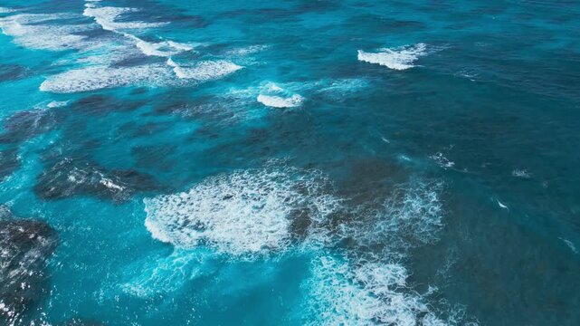 Turquoise Ocean Waves Crashing on Coral Reef, Aerial View