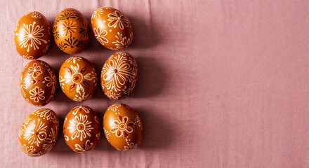 painted easter eggs on pink background with copy space