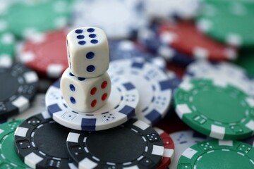 Dice game on the poker table in the casino. A successful combination of dice brought a lot of winning chips
