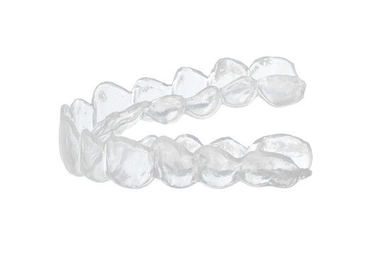 Transparent dental mouth guard for orthodontic treatment and bruxism prevention, clear plastic teeth aligner with detailed tooth impressions isolated on white background, professional closeup shot