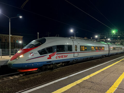 Sapsan high-speed train. Sapsan on the platform at summer night. High-speed train "Russian Railways" for use on the Russian high-speed railways.