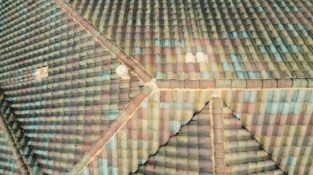 Roof inspection concept with drone, Top down view of tiled roof on a Florida estate home.