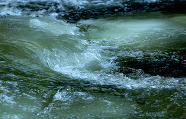 Small, icy rapids in the Sugar River in New Hampshire.