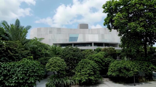 Modern architectural appearance surrounded by green plants Modern under the cover of green trees