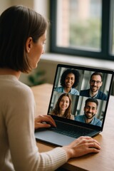 Fototapeta premium Woman participating in virtual business meeting on laptop screen