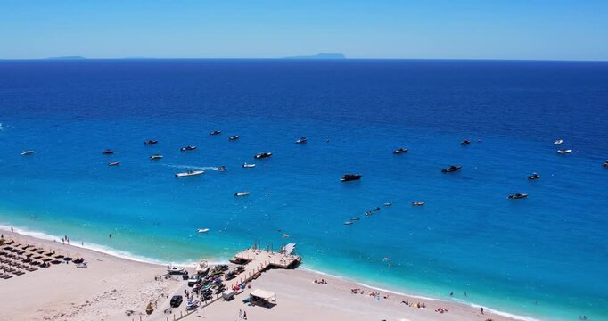 Aerial view of beach clubs along the Himare Albanian Riviera coastline on the Ionian Sea in southern Albania beside vlore.