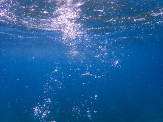 Bubbles under the sea in the crystal clear green sea water. Mediterranean bubbles. Real image very suitable for backgrounds, Rising Bubbles in Deep Underwater, Under with bubble. Great for background.