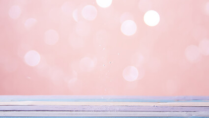 Dreamy Pink Bokeh Background with a Light Blue Wooden Surface for Product Display and Festive Celebrations