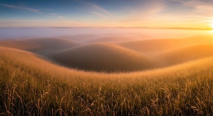 Obraz premium Golden Sunrise over Rolling Hills and Misty Meadows