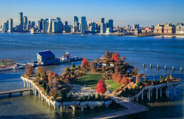 Little Island park at Pier 55 with Jersey City cityscape from New York, USA