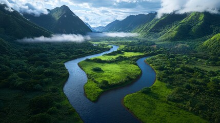 Breathtaking aerial view of a meandering river flowing through lush, green valleys and majestic mountains beneath a vibrant sky