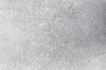 Concrete surface texture showing unique patterns and colors in a well lit environment