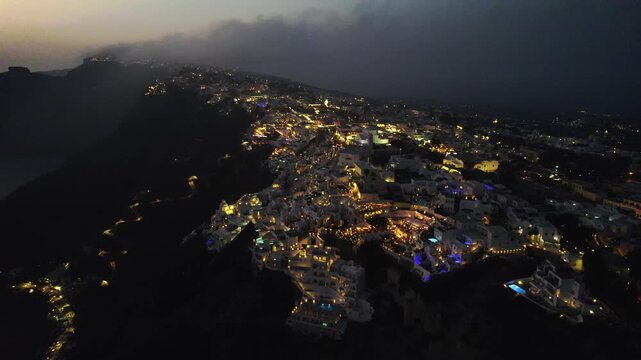 Sunset over Santorini with lights 4K
