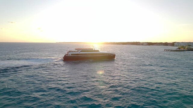 Ferry in front of sunset pulling into harbor 4K