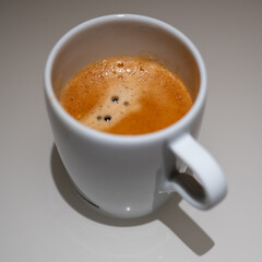 Freshly Brewed Espresso with Golden Crema in White Cup